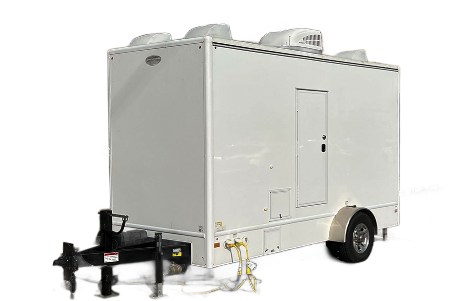 Luxurious Restrooms trailer rental setup at an elegant outdoor event, ensuring sanitation and comfort for guests.